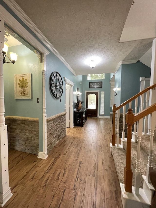 6107 Kyle Bend Ln, Katy, TX 77493 - foyer entrance featuring wood-type flooring, crown molding, stairs, and a textured ceiling