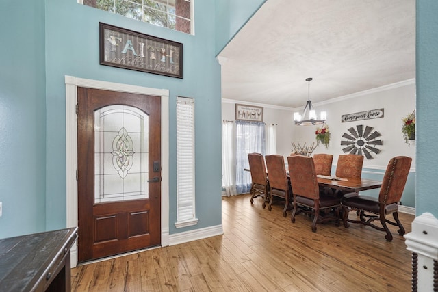 6107 Kyle Bend Ln, Katy, TX 77493 - entryway with a chandelier, wood finished floors, and ornamental molding