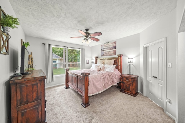 6107 Kyle Bend Ln, Katy, TX 77493 - bedroom with light colored carpet, a ceiling fan, and a textured ceiling