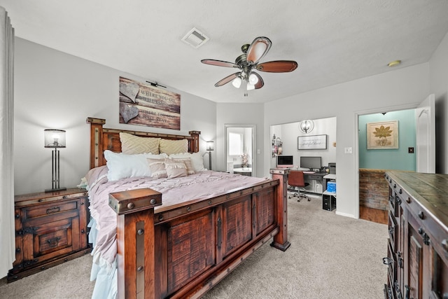 6107 Kyle Bend Ln, Katy, TX 77493 - bedroom with an office area, light carpet, ceiling fan, and ensuite bath