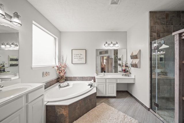 6107 Kyle Bend Ln, Katy, TX 77493 - bathroom with a shower stall, a garden tub, and two vanities