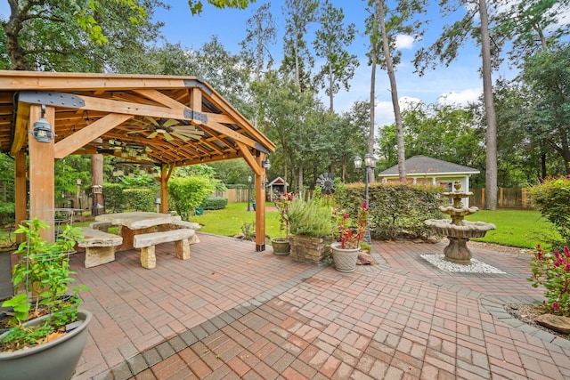 6107 Kyle Bend Ln, Katy, TX 77493 - fenced backyard featuring a gazebo, a patio area, a storage shed, and view of scattered trees