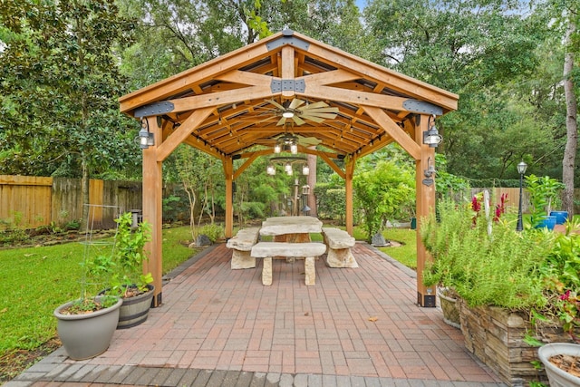 6107 Kyle Bend Ln, Katy, TX 77493 - fenced backyard featuring a gazebo, a patio area, and view of scattered trees
