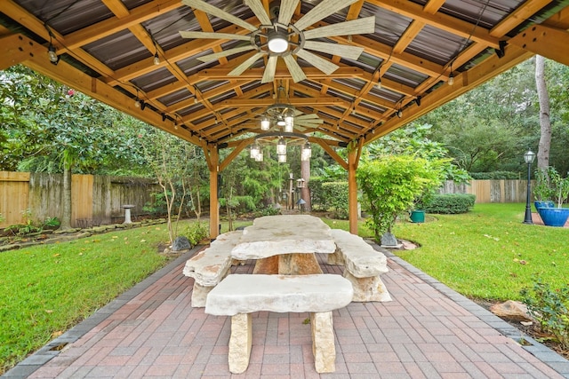 6107 Kyle Bend Ln, Katy, TX 77493 - fenced backyard with a ceiling fan, a patio, a gazebo, and outdoor dining area