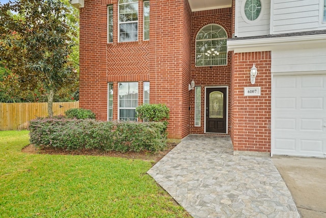 6107 Kyle Bend Ln, Katy, TX 77493 - property entrance featuring a garage, brick siding, and driveway