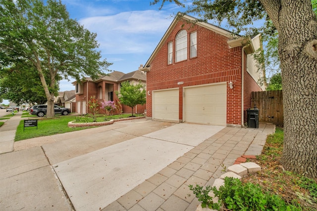 13535 San Martin Ln, Houston, TX 77083 - traditional-style home with brick siding, concrete driveway, and a garage