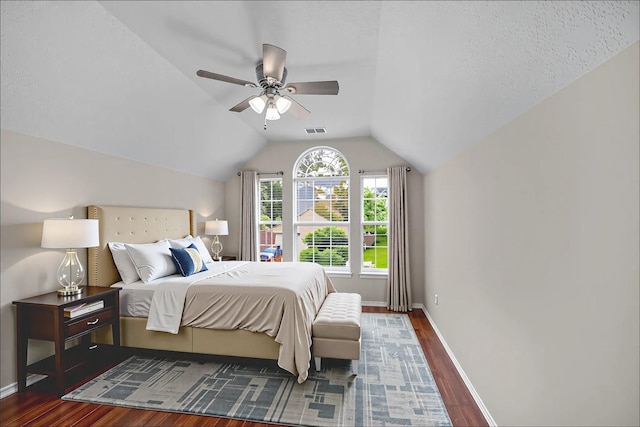 13535 San Martin Ln, Houston, TX 77083 - bedroom with dark wood-style floors, vaulted ceiling, and a ceiling fan
