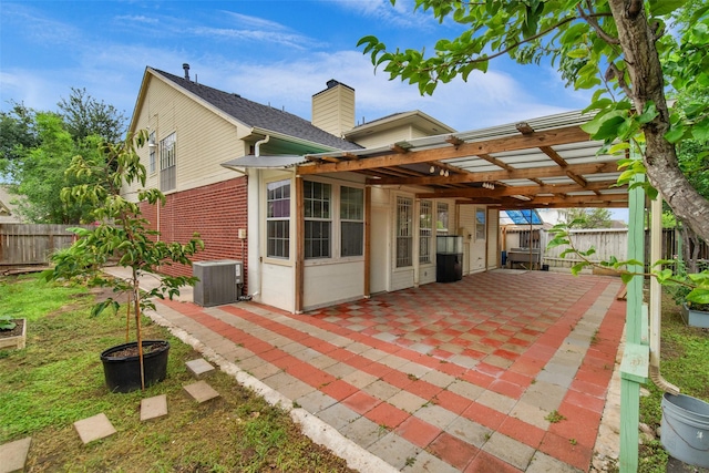 13535 San Martin Ln, Houston, TX 77083 - rear view of property with a patio area, a fenced backyard, a pergola, brick siding, and a chimney