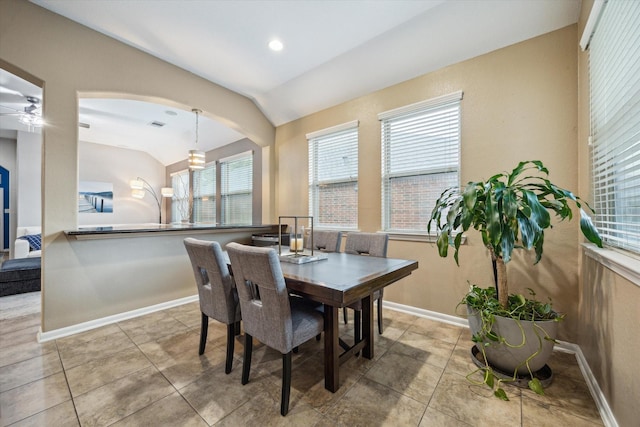 213 Lighthouse Bay Ln, League City, TX 77539 - dining space with lofted ceiling, arched walkways, and light tile patterned floors