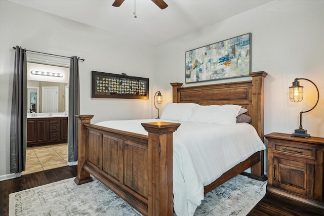 213 Lighthouse Bay Ln, League City, TX 77539 - bedroom with light wood finished floors, connected bathroom, and ceiling fan