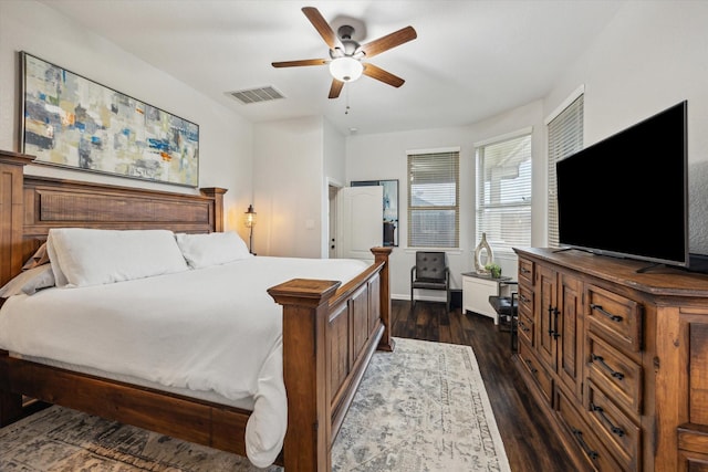 213 Lighthouse Bay Ln, League City, TX 77539 - bedroom with dark wood finished floors and a ceiling fan