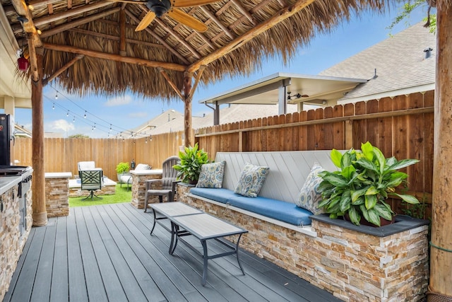 213 Lighthouse Bay Ln, League City, TX 77539 - wooden terrace featuring ceiling fan and a fenced backyard