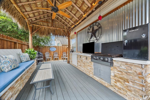 213 Lighthouse Bay Ln, League City, TX 77539 - wooden deck with an outdoor living space, ceiling fan, a fenced backyard, area for grilling, and a gazebo