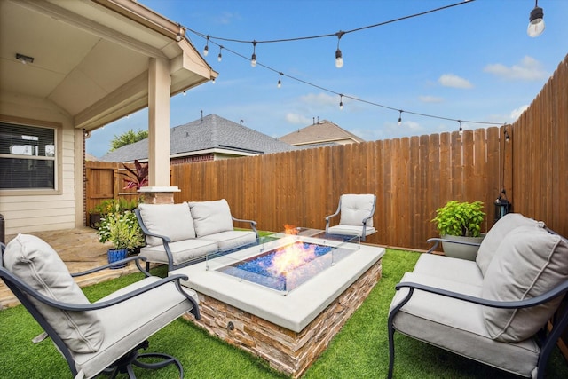 213 Lighthouse Bay Ln, League City, TX 77539 - fenced backyard featuring an outdoor living space with a fire pit and a patio area