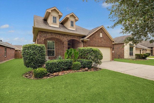 213 Lighthouse Bay Ln, League City, TX 77539 - view of front of property with brick siding, an attached garage, concrete driveway, and roof with shingles