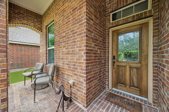 213 Lighthouse Bay Ln, League City, TX 77539 - doorway to property featuring brick siding