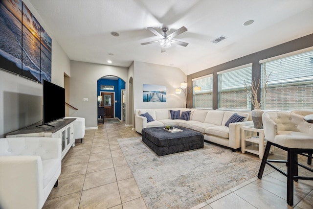 213 Lighthouse Bay Ln, League City, TX 77539 - living area featuring arched walkways, a ceiling fan, and light tile patterned floors