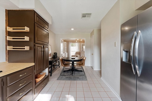 8411 Lylewood Ct, Houston, TX 77040 - dining area featuring light tile patterned floors and baseboards