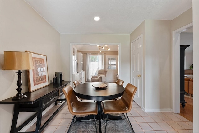 8411 Lylewood Ct, Houston, TX 77040 - dining area with a chandelier and light tile patterned flooring