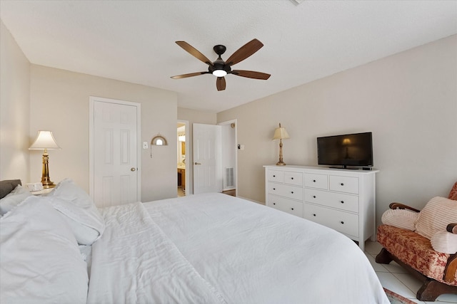 8411 Lylewood Ct, Houston, TX 77040 - tiled bedroom with ceiling fan and connected bathroom