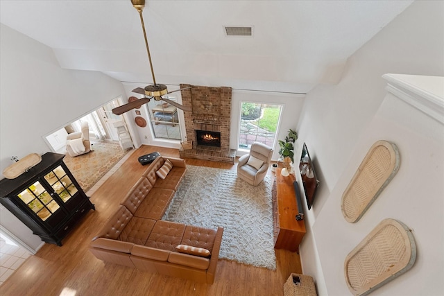 8411 Lylewood Ct, Houston, TX 77040 - living area with wood finished floors, a fireplace, ceiling fan, and vaulted ceiling