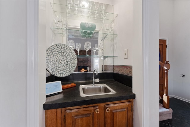 8411 Lylewood Ct, Houston, TX 77040 - indoor wet bar featuring dark tile patterned flooring