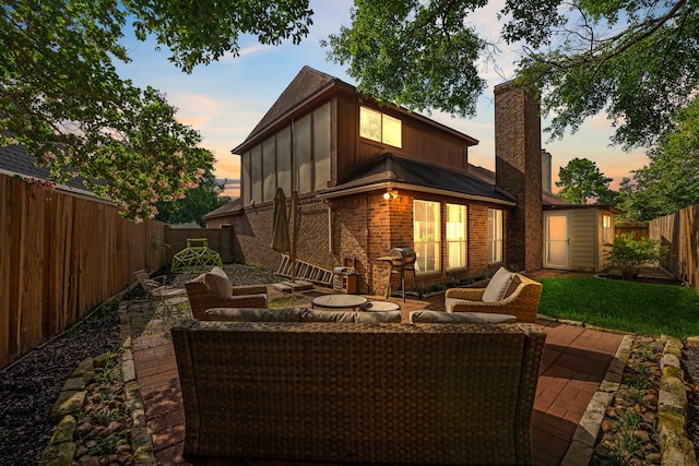 8411 Lylewood Ct, Houston, TX 77040 - rear view of house with board and batten siding, a patio, an outdoor living space, and a fenced backyard