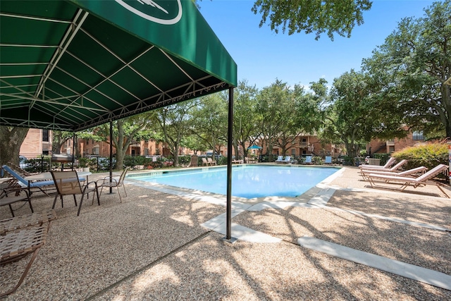 2255 Braeswood Park Dr Unit 184, Houston, TX 77030 - community pool featuring a patio area