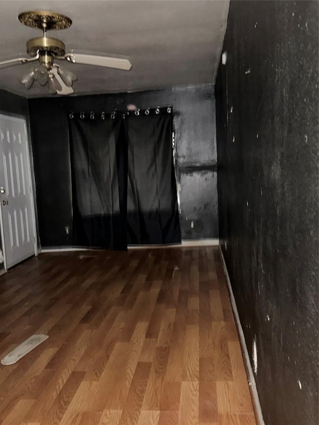 4730 Angleton St, Houston, TX 77033 - empty room with ceiling fan and wood finished floors