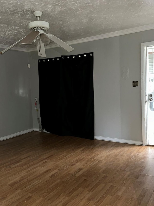 4730 Angleton St, Houston, TX 77033 - unfurnished room with ceiling fan, wood finished floors, crown molding, and a textured ceiling