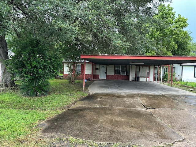 4730 Angleton St, Houston, TX 77033 - view of front facade featuring a carport, concrete driveway, and brick siding