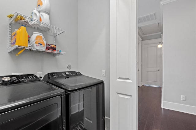 5825 Petty St, Houston, TX 77007 - laundry area with washing machine and clothes dryer, wood finished floors, and crown molding