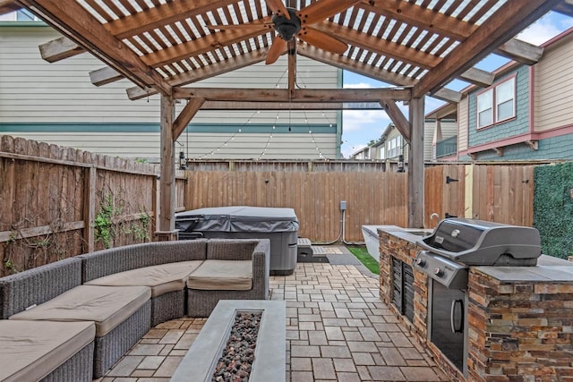 5825 Petty St, Houston, TX 77007 - fenced backyard featuring area for grilling, a hot tub, an outdoor hangout area, ceiling fan, and a patio