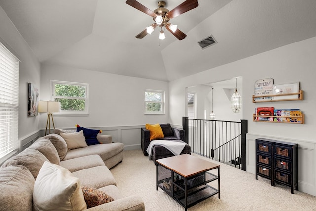 10603 Wagon Trail Rd, Houston, TX 77064 - carpeted living room with a ceiling fan, a wainscoted wall, and lofted ceiling