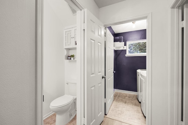 10603 Wagon Trail Rd, Houston, TX 77064 - bathroom with washing machine and clothes dryer and tile patterned floors