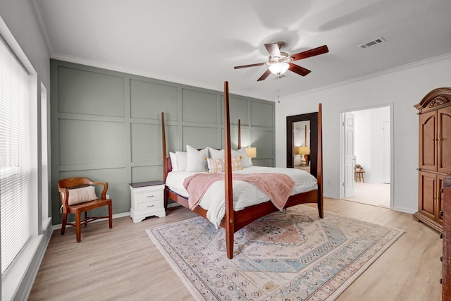10603 Wagon Trail Rd, Houston, TX 77064 - bedroom with a decorative wall, light wood-style flooring, crown molding, and ceiling fan