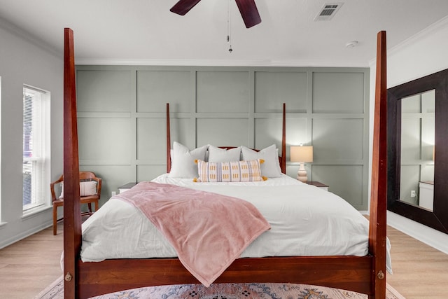 10603 Wagon Trail Rd, Houston, TX 77064 - bedroom featuring a decorative wall, ornamental molding, wood finished floors, and ceiling fan