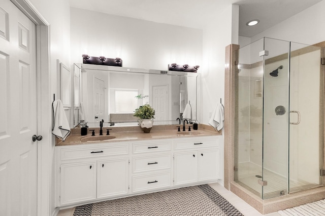 10603 Wagon Trail Rd, Houston, TX 77064 - full bath featuring a stall shower, double vanity, and tile patterned floors