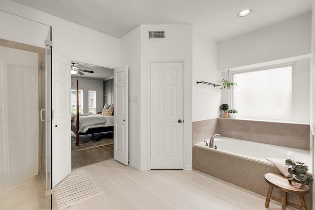 10603 Wagon Trail Rd, Houston, TX 77064 - ensuite bathroom featuring a shower stall, a garden tub, recessed lighting, and a ceiling fan