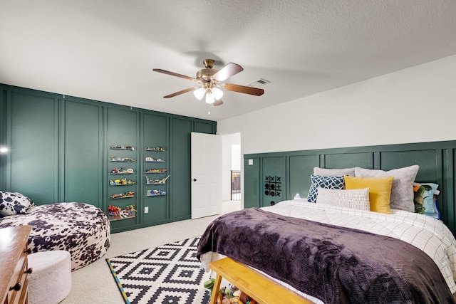 10603 Wagon Trail Rd, Houston, TX 77064 - bedroom with a decorative wall, light colored carpet, and a ceiling fan