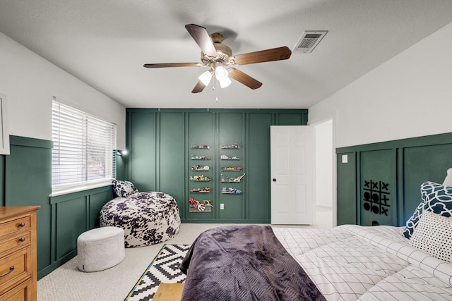 10603 Wagon Trail Rd, Houston, TX 77064 - bedroom with a decorative wall, carpet flooring, and a ceiling fan
