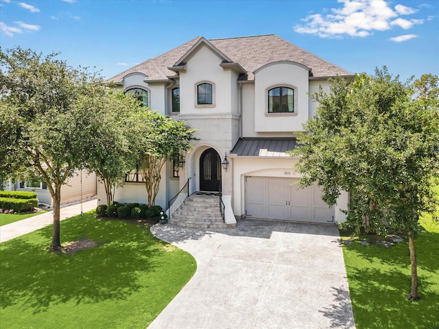 3835 Merrick St, Houston, TX 77025 - french country inspired facade featuring a standing seam roof, a front lawn, an attached garage, concrete driveway, and a shingled roof