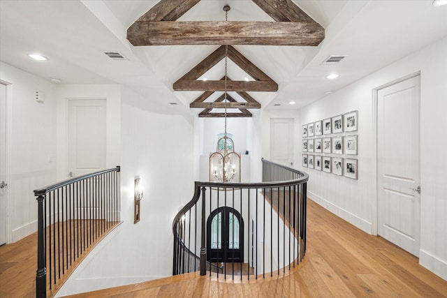 3835 Merrick St, Houston, TX 77025 - hall with an upstairs landing, a chandelier, hardwood / wood-style flooring, beamed ceiling, and recessed lighting
