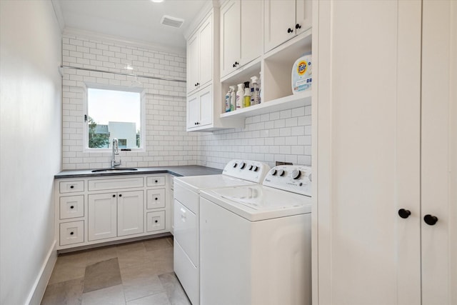 3835 Merrick St, Houston, TX 77025 - washroom featuring washing machine and clothes dryer and cabinet space