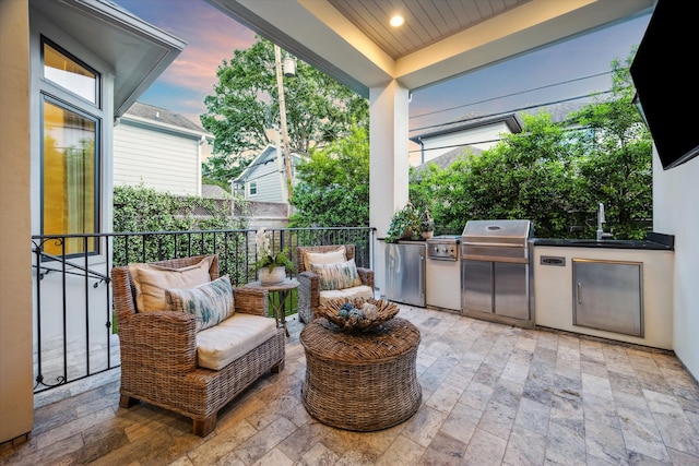 3835 Merrick St, Houston, TX 77025 - view of patio featuring an outdoor kitchen and a sink