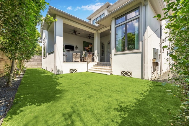 3835 Merrick St, Houston, TX 77025 - back of property with stucco siding, ceiling fan, and covered porch