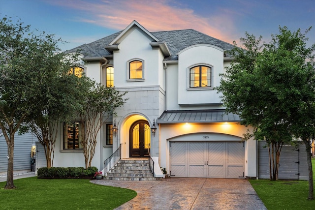 3835 Merrick St, Houston, TX 77025 - french country home featuring french doors, a standing seam roof, driveway, and stucco siding