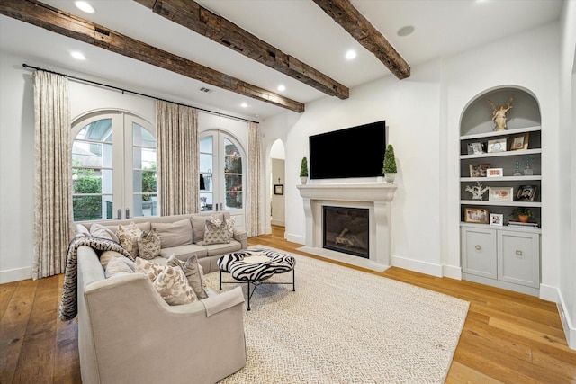 3835 Merrick St, Houston, TX 77025 - living room with plenty of natural light, hardwood / wood-style flooring, a fireplace with flush hearth, recessed lighting, and beam ceiling