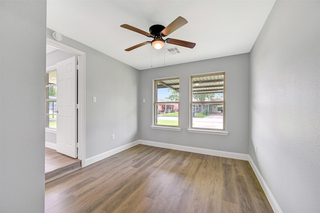 1705 13th St, Galena Park, TX 77547 - unfurnished room with wood finished floors, a ceiling fan, and a smoke detector