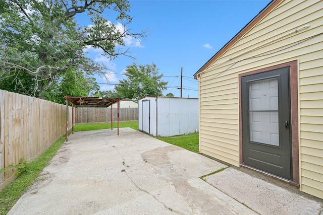 1705 13th St, Galena Park, TX 77547 - fenced backyard with a patio area, a shed, a pergola, and a detached carport